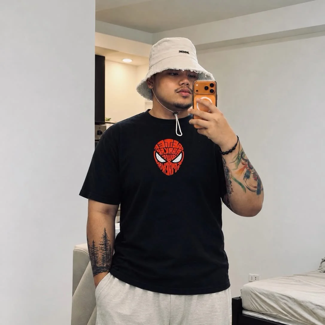 Ean wearing a bucket hat and a black shirt